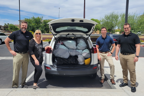 Unison Bank employees held a clothing drive for the House of Refuge. Pictured from left to right is Unison Bank VP Senior Credit Officer, Jeff Suko; House of Refuge Chief Development Officer, Annette Sellers; an Unison Bank Credit Analysts, James Antonakos and Jordan Undem.