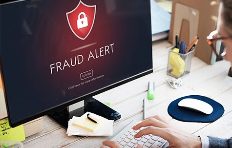 Fraud Alert Message on Laptop