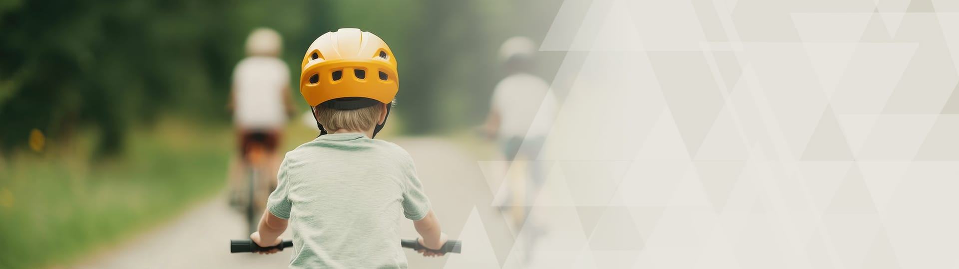 Homepage banner graphic showing child riding his bicycle.