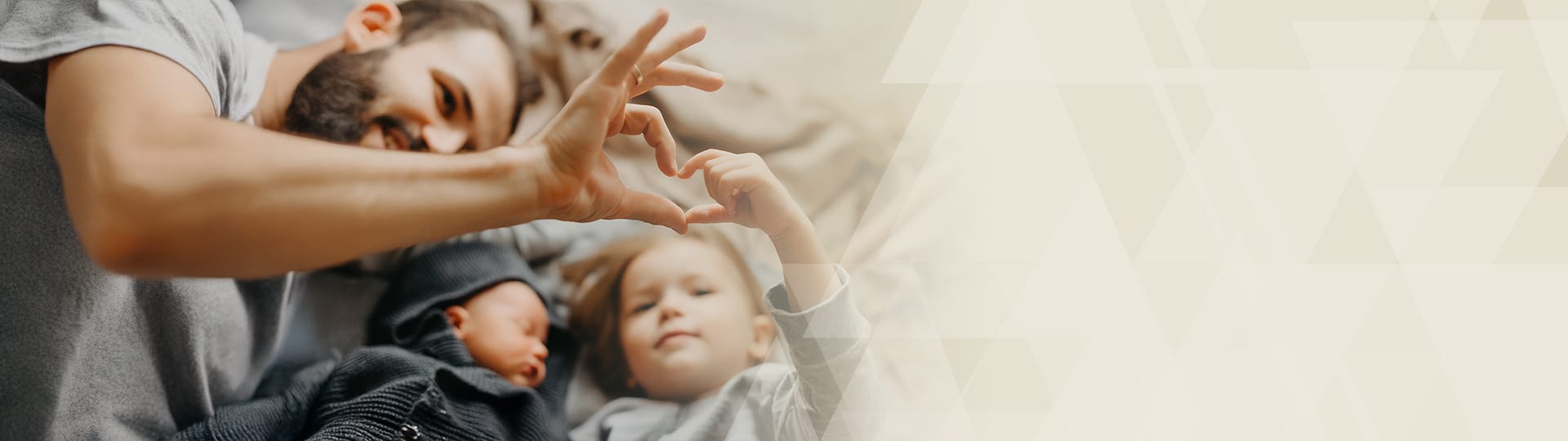 Homepage banner graphic of a father with two children.